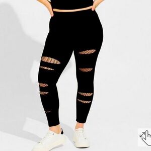Torrid black ripped fish net leggings Size 3